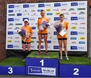 19 June 2022; The womens podium, first place Ciara Hickey of Brothers Pearse AC, centre, Sarah Mulligan of Dundrum South Dublin, right, and third place Yvonne Macauley, left, after the Irish Life Dublin Race Series – Tallaght 5 Mile at Tallaght in Dublin. Photo by David Fitzgerald/Sportsfile