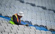 19 June 2022; A steward reads a newspaper in the stands before the Tailteann Cup Semi-Final match between Sligo and Cavan at Croke Park in Dublin. Photo by George Tewkesbury/Sportsfile