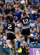 19 June 2022; James Smith of Cavan in action against Nathan Mullen, left, and Keelan Cawley of Sligo during the Tailteann Cup Semi-Final match between Sligo and Cavan at Croke Park in Dublin. Photo by George Tewkesbury/Sportsfile