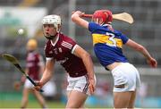 19 June 2022; Rory Burke of Galway in action against Aaron O'Halloran of Tipperary during the Electric Ireland GAA Hurling All-Ireland Minor Championship Semi-Final match between Tipperary and Galway at the LIT Gaelic Grounds in Limerick. Photo by Michael P Ryan/Sportsfile