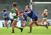 19 June 2022; Kathryn Sullivan of Mayo is tackled by Neasa Byrd of Cavan during the TG4 All-Ireland SFC Group A Round 2 match between Cavan and Mayo at Glennon Brothers Pearse Park in Longford. Photo by Ben McShane/Sportsfile