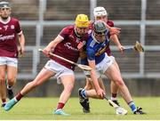 19 June 2022; Adam Daly of Tipperary in action against Orin Burke of Galway during the Electric Ireland GAA Hurling All-Ireland Minor Championship Semi-Final match between Tipperary and Galway at the LIT Gaelic Grounds in Limerick. Photo by Michael P Ryan/Sportsfile