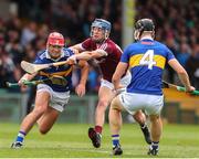 19 June 2022; Jack O'Callaghan of Tipperary in action against Conor Lawless of Galway during the Electric Ireland GAA Hurling All-Ireland Minor Championship Semi-Final match between Tipperary and Galway at the LIT Gaelic Grounds in Limerick. Photo by Michael P Ryan/Sportsfile