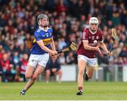 19 June 2022; Cullen Killeen of Galway in action against Adam Daly of Tipperary during the Electric Ireland GAA Hurling All-Ireland Minor Championship Semi-Final match between Tipperary and Galway at the LIT Gaelic Grounds in Limerick. Photo by Michael P Ryan/Sportsfile