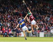 19 June 2022; Aaron Niland of Galway in action against Jack Quinlan of Tipperary during the Electric Ireland GAA Hurling All-Ireland Minor Championship Semi-Final match between Tipperary and Galway at the LIT Gaelic Grounds in Limerick. Photo by Michael P Ryan/Sportsfile