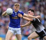19 June 2022; Paddy Lynch of Cavan is tackled by Mikey Gordan of Sligo during the Tailteann Cup Semi-Final match between Sligo and Cavan at Croke Park in Dublin. Photo by Ray McManus/Sportsfile