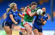 19 June 2022; Aoife Geraghty of Mayo gets through the challenges of Mona Sheridan, left, and Annie Deneher of Cavan during the TG4 All-Ireland SFC Group A Round 2 match between Cavan and Mayo at Glennon Brothers Pearse Park in Longford. Photo by Ben McShane/Sportsfile