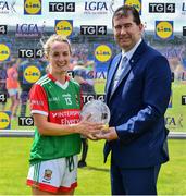 19 June 2022; Lisa Cafferky of Mayo receives the Player of the Match award from LGFA President Mícheál Naughton after the TG4 All-Ireland SFC Group A Round 2 match between Cavan and Mayo at Glennon Brothers Pearse Park in Longford. Photo by Ben McShane/Sportsfile