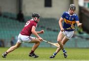 19 June 2022; Adam Daly of Tipperary in action against Paddy MacCárthaigh of Galway during the Electric Ireland GAA Hurling All-Ireland Minor Championship Semi-Final match between Tipperary and Galway at the LIT Gaelic Grounds in Limerick. Photo by Michael P Ryan/Sportsfile