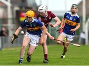 19 June 2022; Cathal English of Tipperary in action against Oscar O'Gorman of Galway during the Electric Ireland GAA Hurling All-Ireland Minor Championship Semi-Final match between Tipperary and Galway at the LIT Gaelic Grounds in Limerick. Photo by Michael P Ryan/Sportsfile
