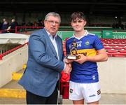19 June 2022; Tom Delaney from Tipperary is presented with the Electric Ireland Best & Fairest Award by Ger Ryan from Munster GAA council for his major performance in the Electric Ireland GAA All-Ireland Minor Hurling Championship Semi-Final match between Tipperary and Galway at LIT Gaelic Grounds in Limerick. Photo by Michael P Ryan/Sportsfile