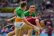 19 June 2022; Ronan O'Toole of Westmeath is tackled by Declan Hogan and Johnny Moloney of Offaly during the Tailteann Cup Semi-Final match between Westmeath and Offaly at Croke Park in Dublin. Photo by Ray McManus/Sportsfile