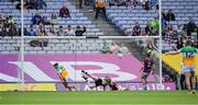 19 June 2022; Keith O'Neill of Offaly, 15, turns to celebrate after beating Westmeath goalkeeper Jason Daley for his side's first goal, in the 17th minute, during the Tailteann Cup Semi-Final match between Westmeath and Offaly at Croke Park in Dublin. Photo by Ray McManus/Sportsfile