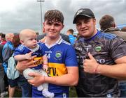 19 June 2022; Tom Delaney of Tipperary celebrates with his brother and 6 months old nephew Joe after the Electric Ireland GAA Hurling All-Ireland Minor Championship Semi-Final match between Tipperary and Galway at the LIT Gaelic Grounds in Limerick. Photo by Michael P Ryan/Sportsfile