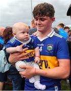 19 June 2022; Tom Delaney of Tipperary celebrates with his 6 months old nephew Joe after the Electric Ireland GAA Hurling All-Ireland Minor Championship Semi-Final match between Tipperary and Galway at the LIT Gaelic Grounds in Limerick. Photo by Michael P Ryan/Sportsfile