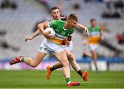 19 June 2022; David Dempsey of Offaly is tackled by Lorcan Dolan of Westmeath during the Tailteann Cup Semi-Final match between Westmeath and Offaly at Croke Park in Dublin. Photo by Ray McManus/Sportsfile