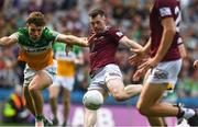 19 June 2022; Lorcan Dolan of Westmeath in action against Rory Egan of Offaly while on his way to scoring his side's second goal during the Tailteann Cup Semi-Final match between Westmeath and Offaly at Croke Park in Dublin. Photo by George Tewkesbury/Sportsfile