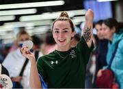 19 June 2022; Ellen Keane with her silver medal as she arrived home from the IPC Para Swimming World Championships 2022 at Dublin Airport in Dublin. Photo by David Fitzgerald/Sportsfile
