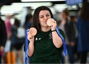 19 June 2022; Nicole Turner with her two bronze medals as she arrived home from the IPC Para Swimming World Championships 2022 at Dublin Airport in Dublin. Photo by David Fitzgerald/Sportsfile