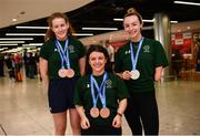 19 June 2022; Medallists, from left, Róisín Ní Ríain with two bronze medals, Nicole Turner with two bronze medals and Ellen Keane with a silver medal as they arrived home from the IPC Para Swimming World Championships 2022 at Dublin Airport in Dublin. Photo by David Fitzgerald/Sportsfile