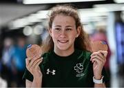 19 June 2022; Róisín Ní Ríain with her two bronze medals as she arrived home from the IPC Para Swimming World Championships 2022 at Dublin Airport in Dublin. Photo by David Fitzgerald/Sportsfile