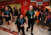 19 June 2022; Medallists, from left, Róisín Ní Ríain, Nicole Turner and Ellen Keane are greeted as they arrive home from the IPC Para Swimming World Championships 2022 at Dublin Airport in Dublin. Photo by David Fitzgerald/Sportsfile