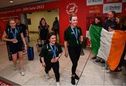 19 June 2022; Medallists, from left, Róisín Ní Ríain, Nicole Turner and Ellen Keane are greeted as they arrive home from the IPC Para Swimming World Championships 2022 at Dublin Airport in Dublin. Photo by David Fitzgerald/Sportsfile