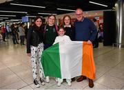 19 June 2022; Amy Sheridan with her dad Shay and sisters, from left, Sally, age 14, Kelly, age 10 and Lucy, age 16, as she arrived home from the IPC Para Swimming World Championships 2022 at Dublin Airport in Dublin. Photo by David Fitzgerald/Sportsfile