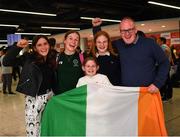 19 June 2022; Amy Sheridan with her dad Shay and sisters, from left, Sally, age 14, Kelly, age 10 and Lucy, age 16, as she arrived home from the IPC Para Swimming World Championships 2022 at Dublin Airport in Dublin. Photo by David Fitzgerald/Sportsfile
