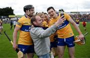 18 June 2022; Kenneth Kelly and Keela pose for a 'selfie' with his brother Tony and fellow Clare players Jack Browne and David Fitzgerald after the GAA Hurling All-Ireland Senior Championship Quarter-Final match between Clare and Wexford at the FBD Semple Stadium in Thurles, Tipperary. Photo by Ray McManus/Sportsfile