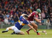 19 June 2022; Aaron Niland of Galway in action against Jack Quinlan of Tipperary during the Electric Ireland GAA Hurling All-Ireland Minor Championship Semi-Final match between Tipperary and Galway at the LIT Gaelic Grounds in Limerick. Photo by Michael P Ryan/Sportsfile