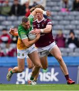 19 June 2022; Anton Sullivan of Offaly is tackled by Jonathan Lynam of Westmeath during the Tailteann Cup Semi-Final match between Westmeath and Offaly at Croke Park in Dublin. Photo by Ray McManus/Sportsfile