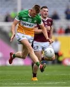 19 June 2022; David Dempsey of Offaly in action against Lorcan Dolan of Westmeath during the Tailteann Cup Semi-Final match between Westmeath and Offaly at Croke Park in Dublin. Photo by Ray McManus/Sportsfile