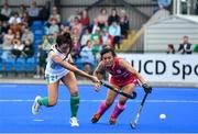 22 June 2022; Katie McKee of Ireland in action against Motomi Kawamura of Japan as she scores her side's first goal during the SoftCo Series International Hockey match between Ireland and Japan at the National Hockey Stadium in UCD, Dublin. Photo by George Tewkesbury/Sportsfile