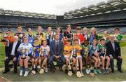 23 June 2022; Alan Black, Customer Relationship Manager - Religious & Education at Allianz, centre, Tadhg Kenny, Uachtarán Cumann na mBunscol, left, and Jerry Grogan, PRO, Cumann na mBunscol, right, with with winning captains Aoibhinn O'Farrell, Scoil Thomáis, Ava Grace O'Riordan, Scoil Thomáis, Annie McCauley, Loretto Grange Road, Úna ó Bréartúin, Gaelscoil Chnoc Liamhna, Caoimhe Phelan, St Olaf's N.S., Mia Coleman, Gaelscoil Inse Chór, Amy Nic Calharr, Scoil Mológa, Béibhinn O'Donnell, Loretto PS, Dalkey, Cara Keane, Holly Park GNS, Eadaoin McClean, Holly Park GNS, Tom O'Halloran, Scoil Lorcán Naofa, Joseph Davy, Scoil Lorcán Naofa, Matthew Molloy, St Cronan's, Brackenstown, Richard McCann, Griffith Barracks NS, Harry Mac Eoghain, Scoil Naithí, Peter Nurray, Scoil Bhríde, Ronan Feerick, St Bridid's Killester, Luke Coughlan, at the Allianz Cumann na mBunscol captain presentations in Croke Park, Dublin. Photo by Ray McManus/Sportsfile