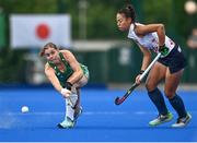 23 June 2022; Katie Mullan of Ireland in action against Yuu Asai of Japan during the SoftCo Series match between Ireland and Japan at National Hockey Stadium in UCD, Dublin. Photo by David Fitzgerald/Sportsfile