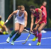 22 June 2022; Katie Mullan of Ireland in action against Amiru Shimada of Japan during the SoftCo Series International Hockey match between Ireland and Japan at the National Hockey Stadium in UCD, Dublin. Photo by George Tewkesbury/Sportsfile