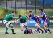 24 June 2022; Fionn Gibbons of Ireland goes over Killian Tixeront of France during the Six Nations U20 summer series match between Ireland and France at Payanini Centre in Verona, Italy. Photo by Roberto Bregani/Sportsfile