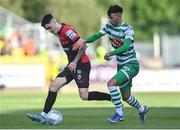 24 June 2022; Dawson Devoy of Bohemians in action against Danny Mandroiu of Shamrock Rovers during the SSE Airtricity League Premier Division match between Shamrock Rovers and Bohemians at Tallaght Stadium in Dublin. Photo by Ramsey Cardy/Sportsfile
