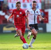 24 June 2022; Brian McManus of Shelbourne in action against Robbie Benson of Dundalk during the SSE Airtricity League Premier Division match between Shelbourne and Dundalk at Tolka Park in Dublin. Photo by Michael P Ryan/Sportsfile