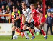 24 June 2022; Paul Doyle of Dundalk in action against JJ Lunney of Shelbourne during the SSE Airtricity League Premier Division match between Shelbourne and Dundalk at Tolka Park in Dublin. Photo by Michael P Ryan/Sportsfile
