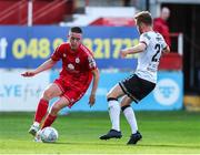 24 June 2022; Jack Moylan of Shelbourne in action against Paul Doyle of Dundalk during the SSE Airtricity League Premier Division match between Shelbourne and Dundalk at Tolka Park in Dublin. Photo by Michael P Ryan/Sportsfile