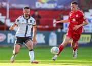 24 June 2022; Robbie Benson of Dundalk in action against Jack Moylan of Shelbourne during the SSE Airtricity League Premier Division match between Shelbourne and Dundalk at Tolka Park in Dublin. Photo by Michael P Ryan/Sportsfile