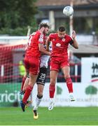 24 June 2022; David McMillan of Dundalk in action against Shelbourne players Aaron O'Driscoll, left, and Luke Byrne during the SSE Airtricity League Premier Division match between Shelbourne and Dundalk at Tolka Park in Dublin. Photo by Michael P Ryan/Sportsfile