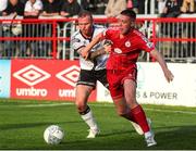 24 June 2022; Jack Moylan of Shelbourne in action against Mark Connolly of Dundalk during the SSE Airtricity League Premier Division match between Shelbourne and Dundalk at Tolka Park in Dublin. Photo by Michael P Ryan/Sportsfile