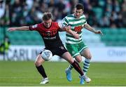 24 June 2022; Conor Levingston of Bohemians is tackled by Aaron Greene of Shamrock Rovers during the SSE Airtricity League Premier Division match between Shamrock Rovers and Bohemians at Tallaght Stadium in Dublin. Photo by George Tewkesbury/Sportsfile