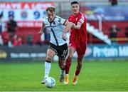 24 June 2022; Greg Sloggett of Dundalk in action against Sean Boyd of Shelbourne during the SSE Airtricity League Premier Division match between Shelbourne and Dundalk at Tolka Park in Dublin. Photo by Michael P Ryan/Sportsfile
