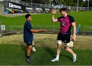 25 June 2022; Ryan Baird with De La Salle college student Pesamino Ah Tong Sefo as they try hurling after Ireland rugby squad training at North Harbour Stadium in Auckland, New Zealand. Photo by Brendan Moran/Sportsfile
