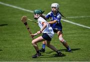 25 June 2022; Eva Ní Fhloinn of Athenry in action against Alison Davis of Killeedy during the John West Féile na nGael National Camogie and Hurling Finals, 2022 at the GAA National Games Development Centre Campus, Abbotstown today. Eighty club sides from Ireland, the UK, Europe and US competed in the final stages of the under-15 competition across 10 venues in Dublin and Meath. Sponsored for the seventh time by John West, it is one of the biggest underage sporting events on the continent. Photo by David Fitzgerald/Sportsfile
