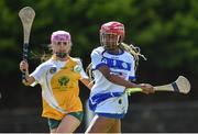 25 June 2022; Stephanie Dumevi of Tramore, Waterford, in action against Megan Donnelly of Naomh Bríd, Armagh, during the John West Féile na nGael National Camogie and Hurling Finals at Kiltale GAA in Meath. Photo by Daire Brennan/Sportsfile